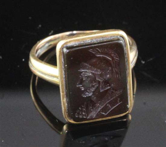 An antique gold and carnelian intaglio ring, size O.